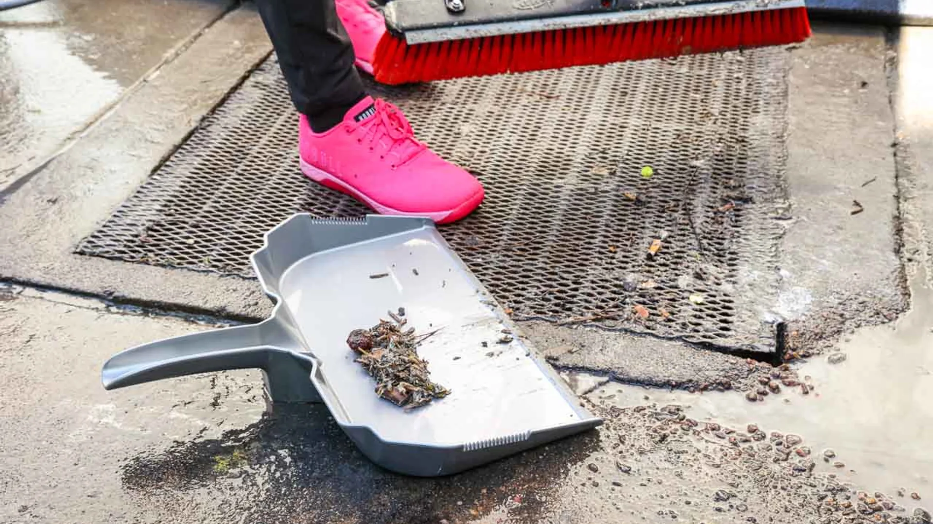 Britebin pressure washing a commercial dumpster pad and enclosure