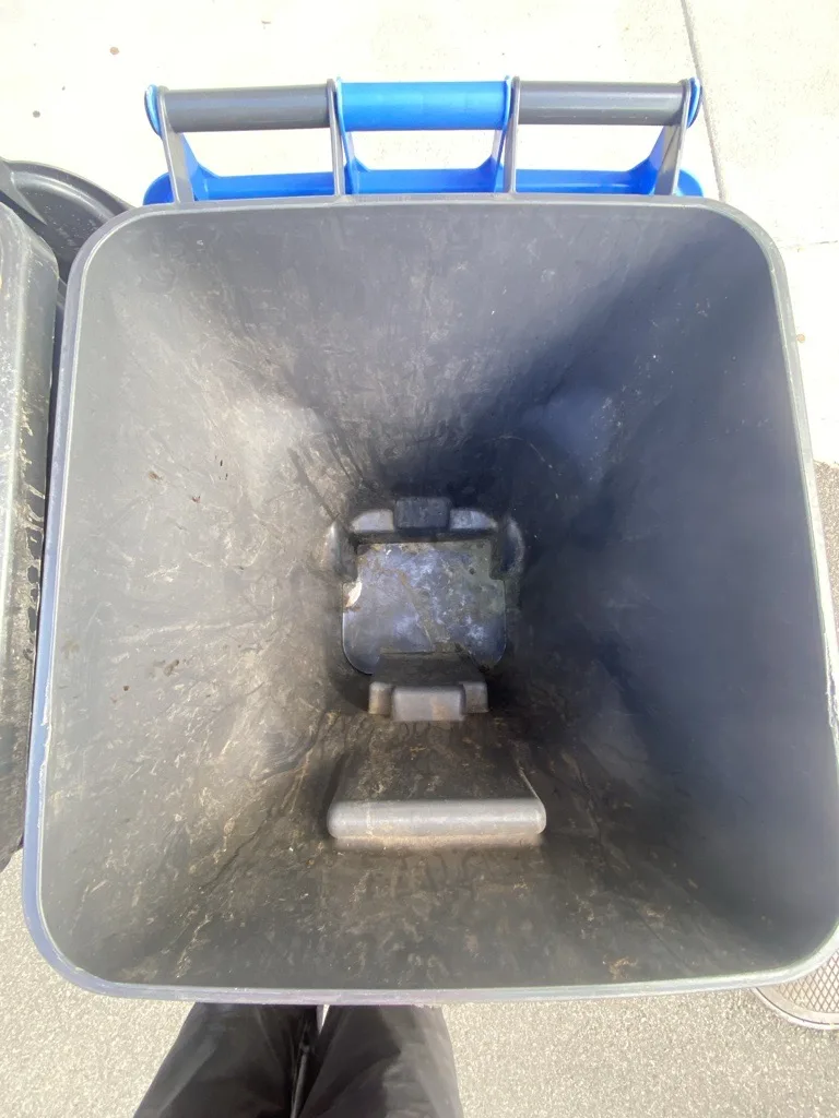 Interior of a residential trash bin in Denver before professional cleaning